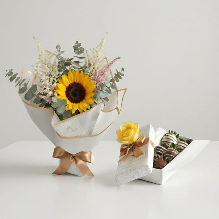 Ramo premium con girasol y eucalipto junto a caja de 6 fresas con chocolate y rosa amarilla Fruit Santé en Bogotá