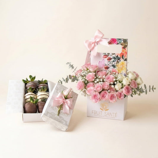 Dúo Jardín Floral pastel con rosas rosadas y blancas en caja jardinera y caja de fresas con chocolate